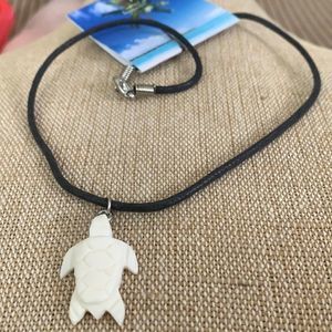 Turtle  with black necklace